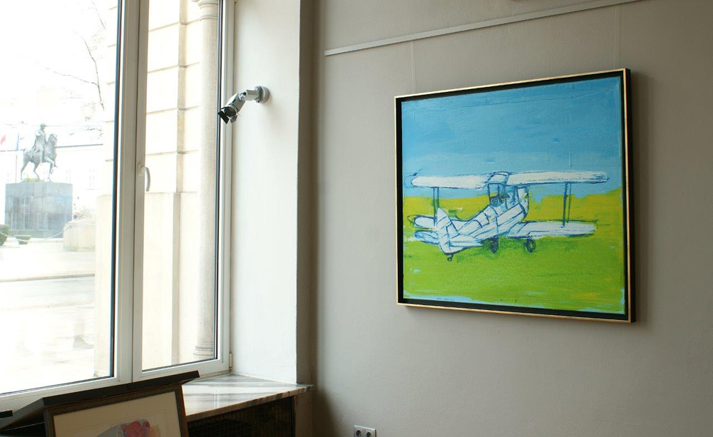 Jacek Łydżba - White biplane on the green grass (Oil on Canvas | Size: 126 x 106 cm | Price: 7000 PLN)