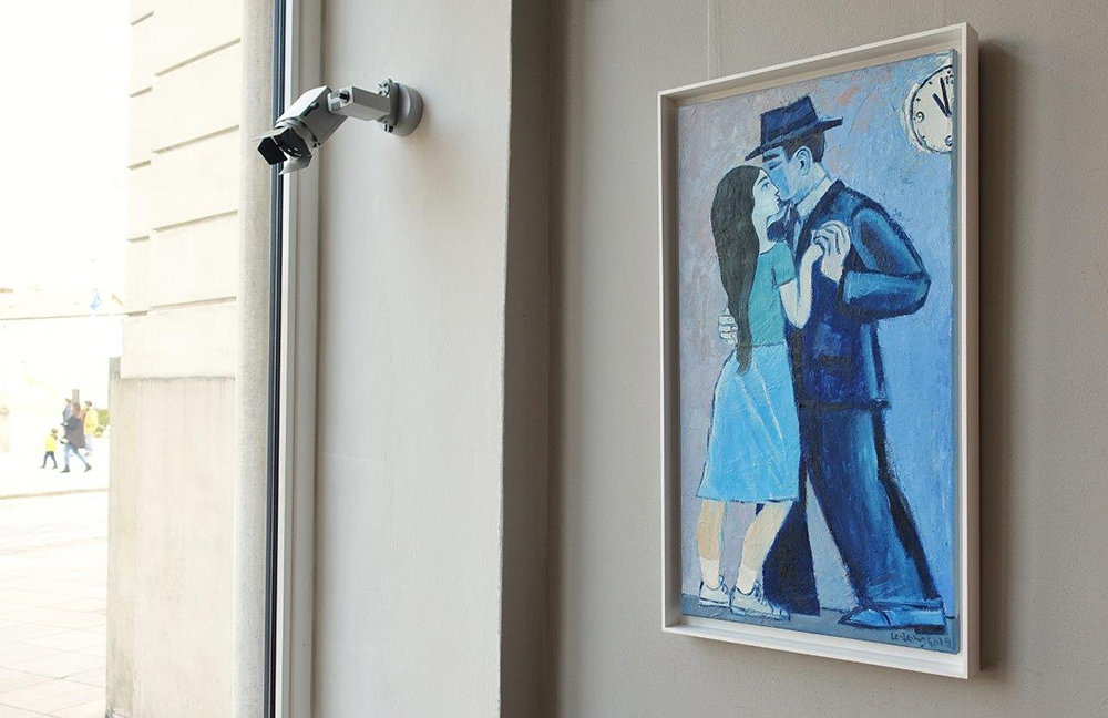 Krzysztof Kokoryn - Couple under the clock (Oil on Canvas | Size: 59 x 96 cm | Price: 6000 PLN)